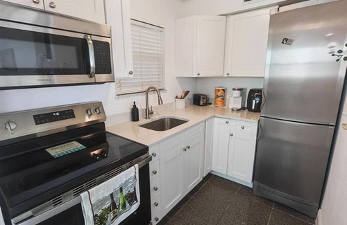 Capri Isle Apartment | Treasure Island Waterfront Oasis Minutes to Beach Dock Sunsets at John’s Pass