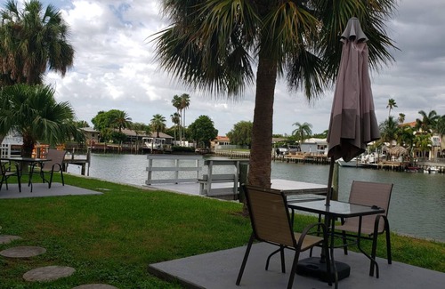 Capri Isle Apartment | Treasure Island Waterfront Oasis Minutes to Beach Dock Sunsets at John’s Pass