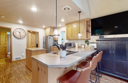 Anderson Island House | Tree-lined Anderson Island home with porch & fenced yard, near dock/tennis