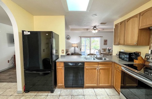 Port Charlotte House | Tropical Home With Waterfall, HotTub, Fenced Yard, Beachy Lounge Area & Pets!