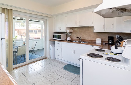 Melaleuca Gardens House | Tropical oasis with canal views. A fishing adventure near the beach!