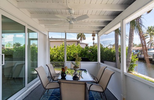 Melaleuca Gardens House | Tropical oasis with canal views. A fishing adventure near the beach!