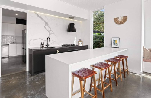 Newport House | Tropical outlook with heated pool close to beaches