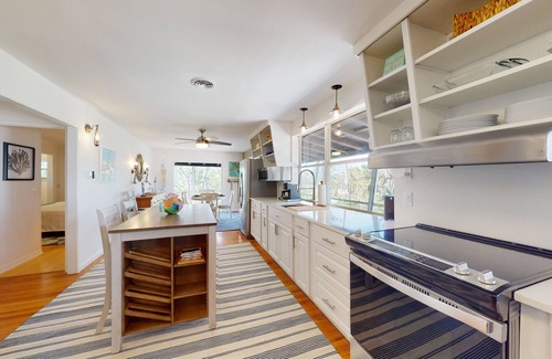 Palm Island House | Tropical Palm Island home steps from the beach with grill, outdoor shower, dock