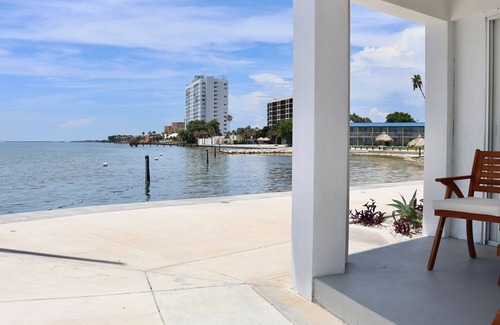 Pinellas Point House | Tropical Retreat: Outdoor Pools, Private Beach, Waterfront Dining