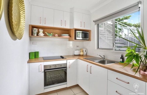 Parramatta Park Apartment | Tropicana Pineapple - Chic Retreat with Private Courtyard & BBQ