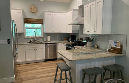 Englewood House | Tucked Away on Wooded Way located blocks from Manasota Beach with Heated Pool.