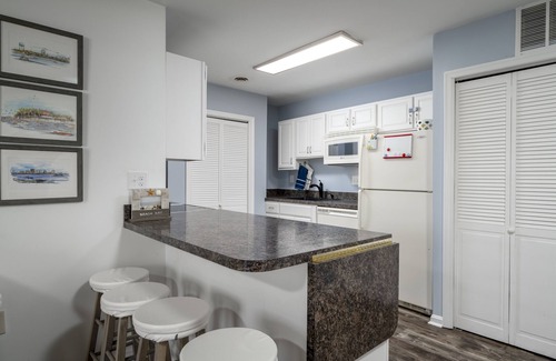 Heron Harbour Isle Condo | Two bedroom. 2 bath bayside condo with outdoor pool and private courtyard