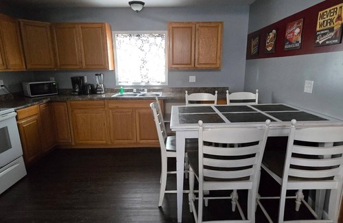Monticello Cabin | Two Bedroom Cabin - "The Big One" - This spacious cabin gets it's name honestly! Cabin is 800 sq ft with two-bedrooms feature three (3) queen beds, one (1) full size bed, and two (2) futons allow for a max of twelve (12) people. Conveniently located