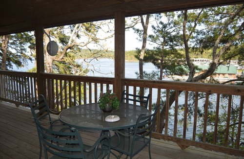 Mount Ida Cottage | Two bedroom, two bath, log-sided, luxury Harbor North cottage overlooking Lake Ouachita. by RedAwning
