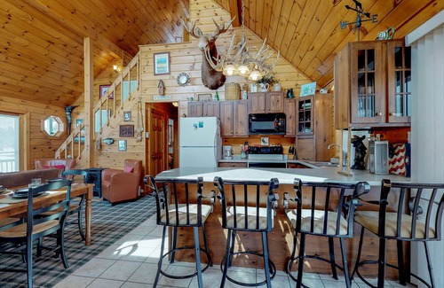 Greenville House | Two lakefront dog-friendly cabins on four acres with porches, dock, & lake views