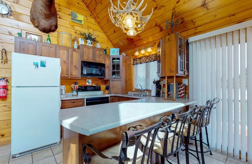 Greenville House | Two lakefront dog-friendly cabins on four acres with porches, dock, & lake views