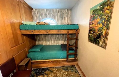 Marble Falls House | Two-Story Cabin Rental for Large Groups along Hamilton Creek in Marble Falls, Texas