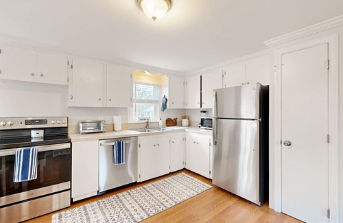 Harwich House | Two-story dog-friendly retreat with enclosed yard, playset, W/D, & firepit