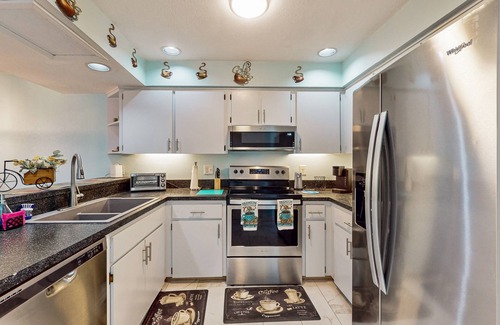 Inverness House | Two-story townhome with lake access, pool, bbq grill, screened patio