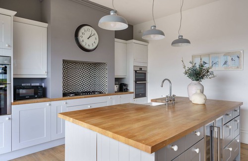 Llanerchymedd Cottage | Tŷ a Chaban Carmel - Carmel House and Cabin - sleeps 22, stunning views, hot tub & wood burner