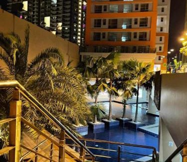 Pasig Apartment | U607 Sunshine100 Netflix 65InchesTV Wifi Karaoke Swimming Pool