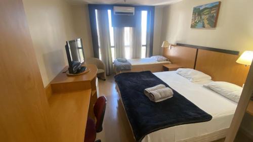 Taguatinga Hotel | UH 406 - 3 Pessoas e garagem