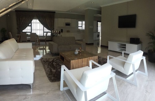 Robertsham House | Ultra modern and luxurious self catering villa- safe and secure, central