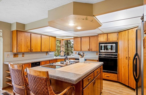 Liberty Lake House | Unique lakefront hideaway with four decks, dock, private hot tub & wood stove