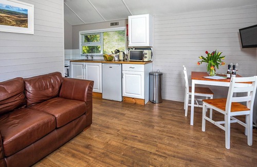 Berrynarbor Ski Chalet | Unique, peaceful, cosy and quaint cedar wood built holiday lodge.