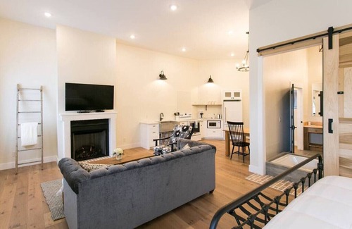 Millersburg Apartment | Unique Rustic Suite with Jacuzzi Tub, Kitchen, Fireplace, and Living Room