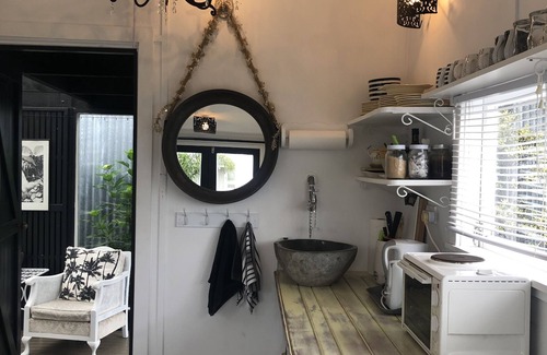 Whitianga Cottage | Unique Tiny homes with fabulous views and cosy internal courtyard.