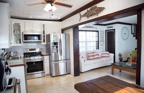 Dunmore Town House | Unique waterfront Harbour Island getaway! 2 house compound with private dock!