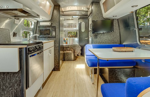 Menlo House | Updated Airstream tucked into trees with firepit, full bathroom & kitchenette