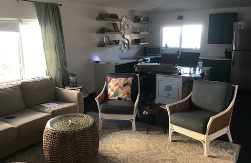 Satellite Beach Condo | Updated Condo with Beach View 30 steps away from your toes being in the sand!