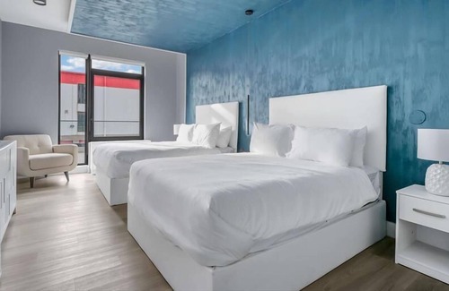 Mott Haven House | Upscale Double Queen Suite | Mott Haven | Fitness Center | Free WiFi