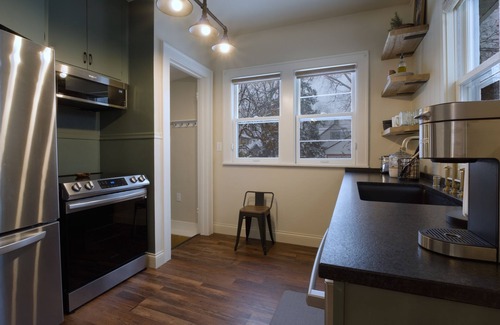 Midway House | Urban Retreat- Entire House. King beds. Central location.
