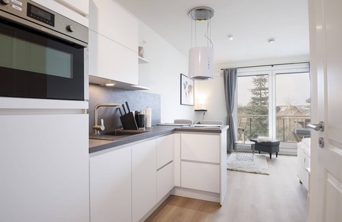 Neustadt in Holstein Apartment | Vacation apartment Kleine Perle in house Pier 67 with balcony in Neustadt