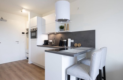 Neustadt in Holstein Apartment | Vacation apartment Kleine Perle in house Pier 67 with balcony in Neustadt