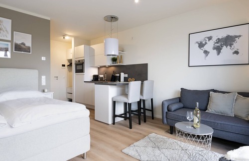 Neustadt in Holstein Apartment | Vacation apartment Kleine Perle in house Pier 67 with balcony in Neustadt