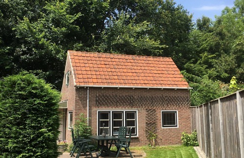 Zoutelande Cottage | Vacation at the foot of the dunes in atmospheric apartment with garden and parking.