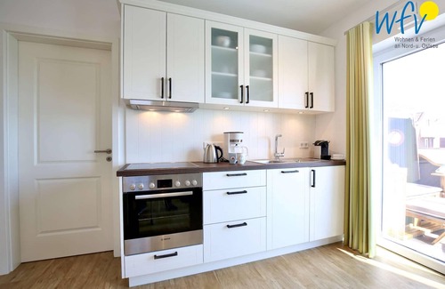 Wangerooge Apartment | Vacation with a sunny balcony and your own beach chair on the beach