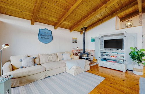 Coupeville House | Vibrant dog-friendly home with fireplace, patio, gas grill, deck, & board games