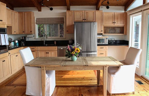 Coupeville House | Vibrant dog-friendly home with fireplace, patio, gas grill, deck, & board games