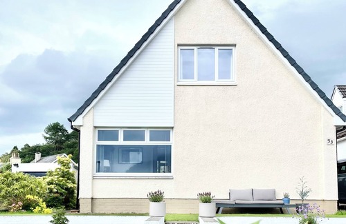 Corpach House | Views of Ben Nevis. Sleeps 5. 2 bedrooms. Garden. Parking. Beach/Canal.