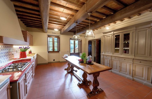 Torricella Villa | Villa Lago is set against a hillside of luscious greenery olive groves