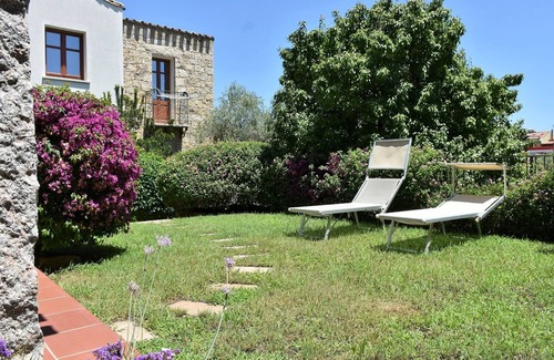 Lotzorai Apartment | Villa Menhir. Mediterranean garden. Mountain view.