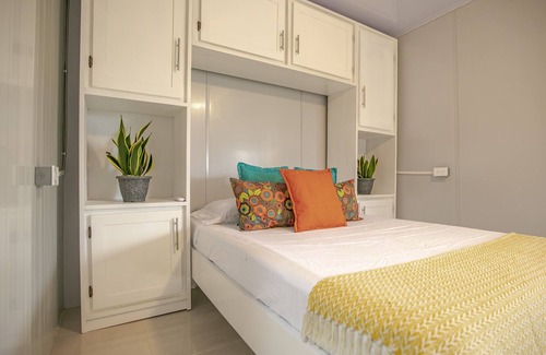 Barrio Pilo Villa | Villa Palmera es un Espacio Acogedor con Amplios Jardines, Piscina, Rancho BBQ