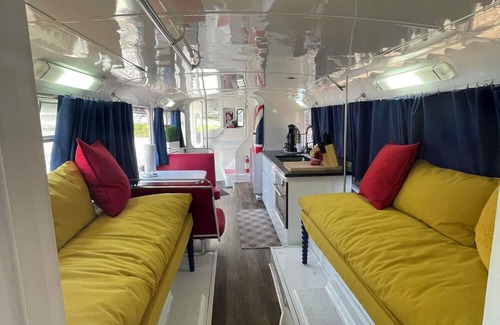 Mill Spring Apartment | Vintage 1962 double decker bus on the creek, gas grill, fire pit, short walk to pool and playground, sleeps 4-5.