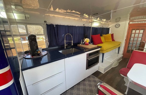 Mill Spring Apartment | Vintage 1962 double decker bus on the creek, gas grill, fire pit, short walk to pool and playground, sleeps 4-5.