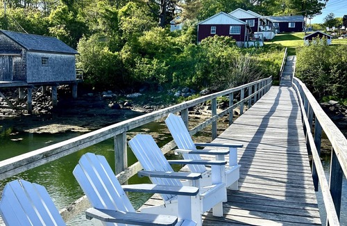 New Harbor Cottage | Vintage cabin perched on edge of harbor with dock