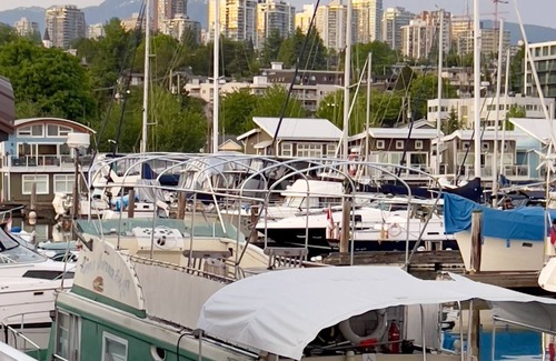Lower Lonsdale Boat Rental | Vintage Houseboat moored in spectacular Marina nearby Seabus in North Vancouver