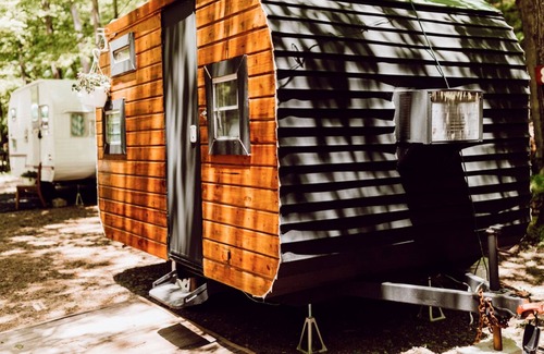 Gnaw Bone RV Rental | Vintage wood camper in Brown County
