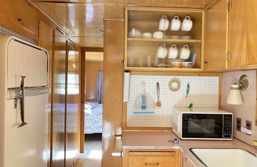 Kernville House | Vintage wood paneled travel trailer on Kernville Ranch: horses, river, hot tub