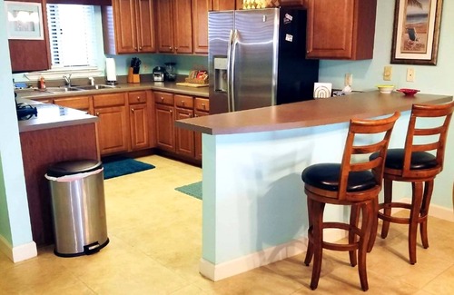 Ono Island Condo | VRBO Rated #1 Sandy Key 424 Includes ground floor storage with chairs & umbrella